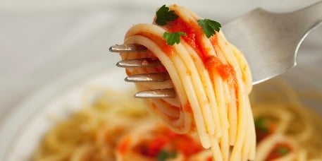 A plate of food with a fork
Description automatically generated
